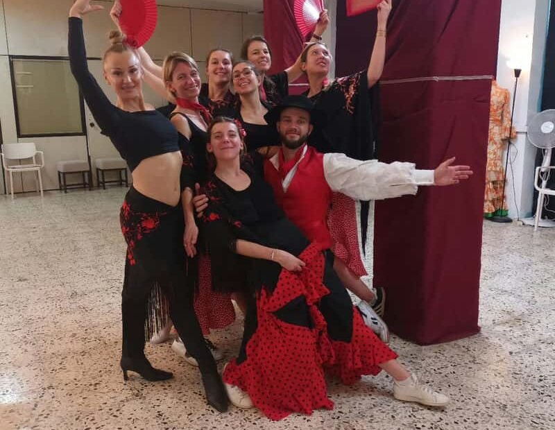Group of colleagues for a flamenco workshop with Baila Baila in the city center of Barcelona, during a corporate seminar
