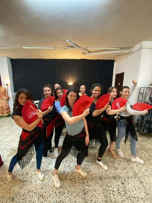 Group of girls with fans for a flamenco workshop - authentic experience in barcelona, in the born area, city center